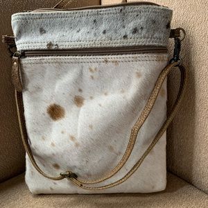 Myra crossbody, pony leather bag. Brand new condition. Great travel piece.